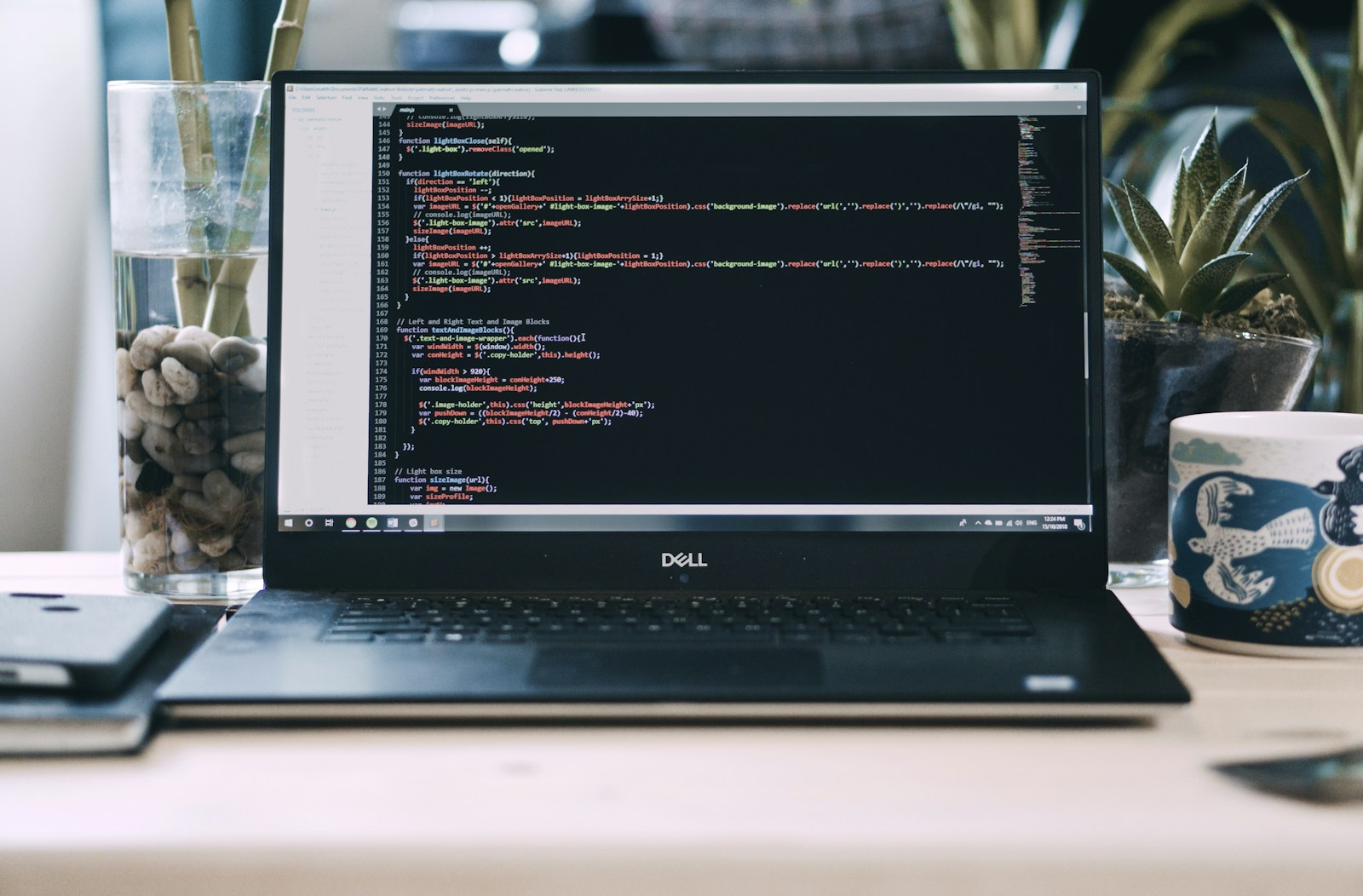 a laptop computer sitting on top of a desk