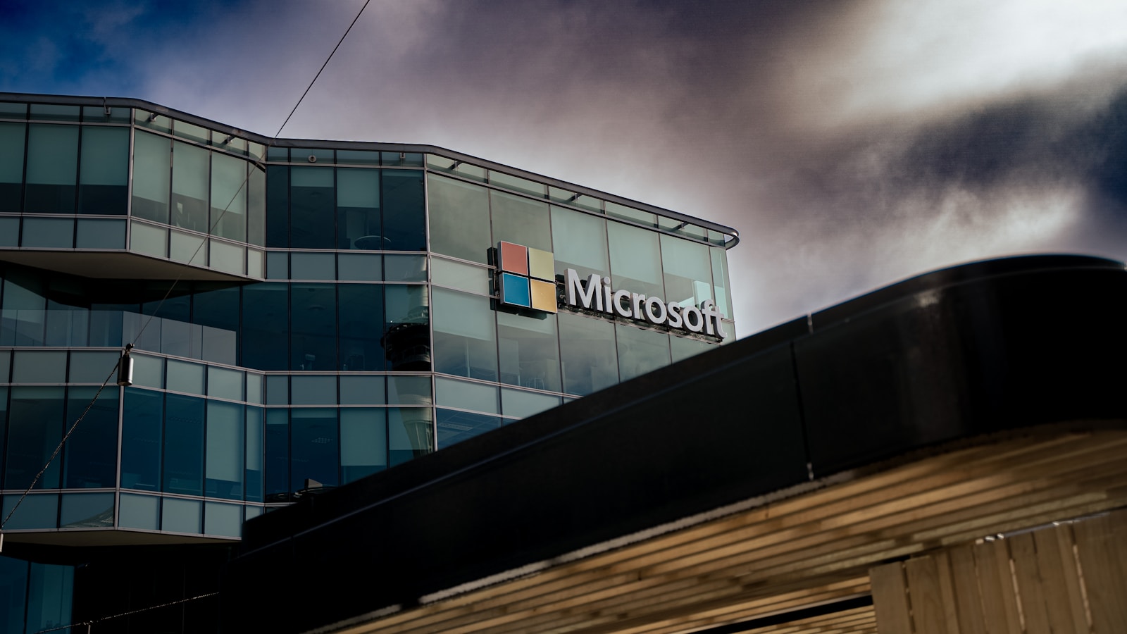 A building with a cloudy sky in the background — Azure API Management: API Gateway ve Geliştirici Portalı